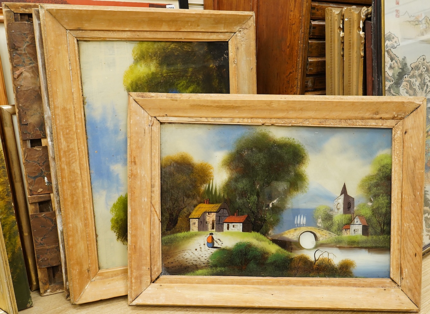 Victorian school, Riverscapes, set of four reverse glass painted panels, 39 x 59cm
